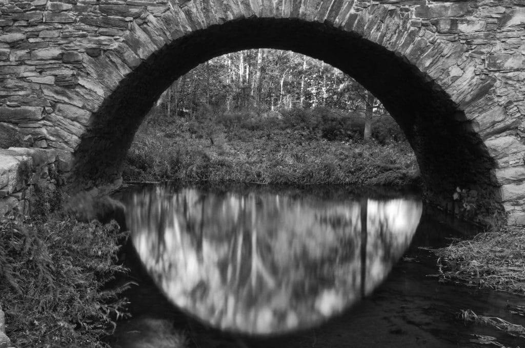 About me.  An historical stone-arch bridge on which I played as a child.