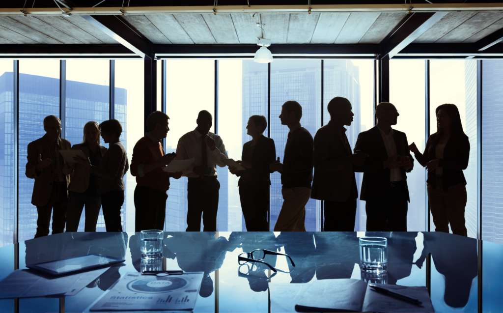 Silhouette of people in board room.  Who will be cancelled?