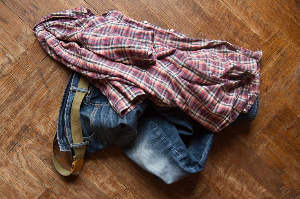 Dirty shirt and jeans on floor