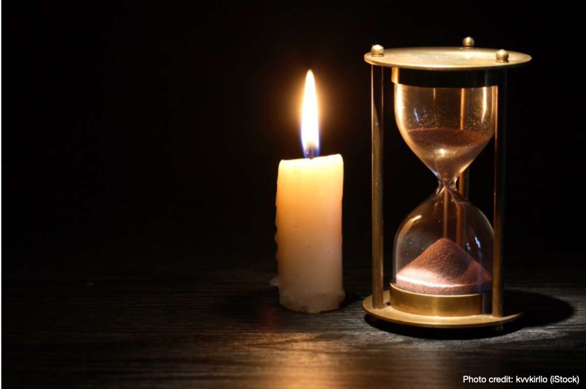 Candle and hourglass indicating all of our yesterdays