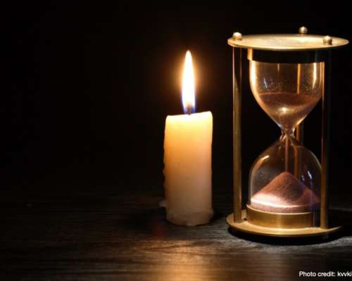 Candle and hourglass indicating all of our yesterdays