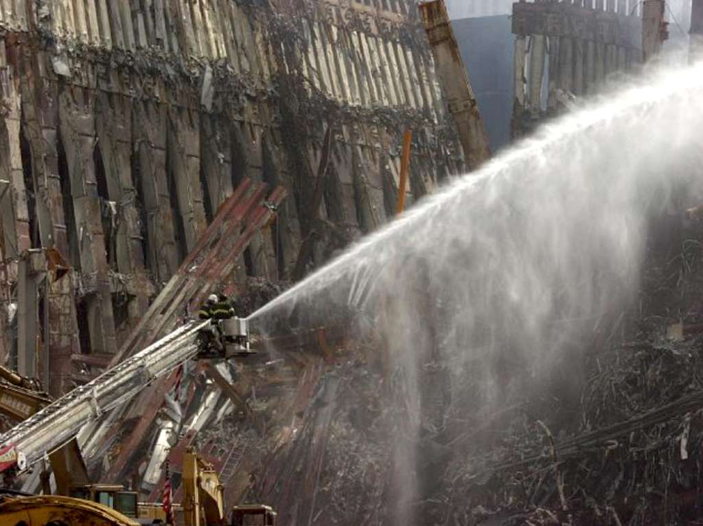 the-wtc-attacks-remembered firemen fighting fire