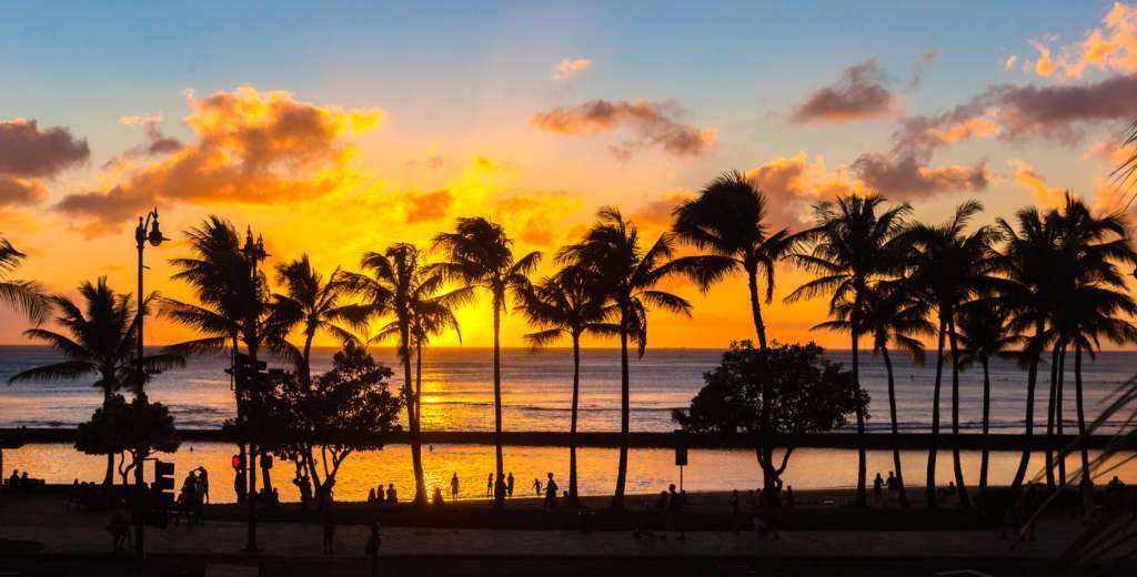 Two tickets to paradise;  Sunset on Oahu.  Hawaii vacation.